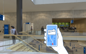 Hand holding a smartphone with navigation directions inside a modern terminal with visible wayfinding signs