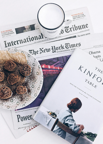 The New York Times Newspaper under a meal.
